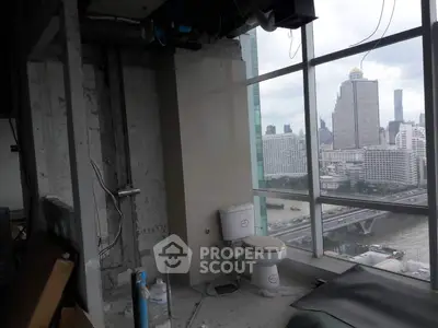 Unfinished high-rise bathroom with city skyline view, potential for luxury renovation.