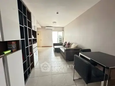 Spacious living room with modern furniture and open layout, perfect for relaxation and entertainment.