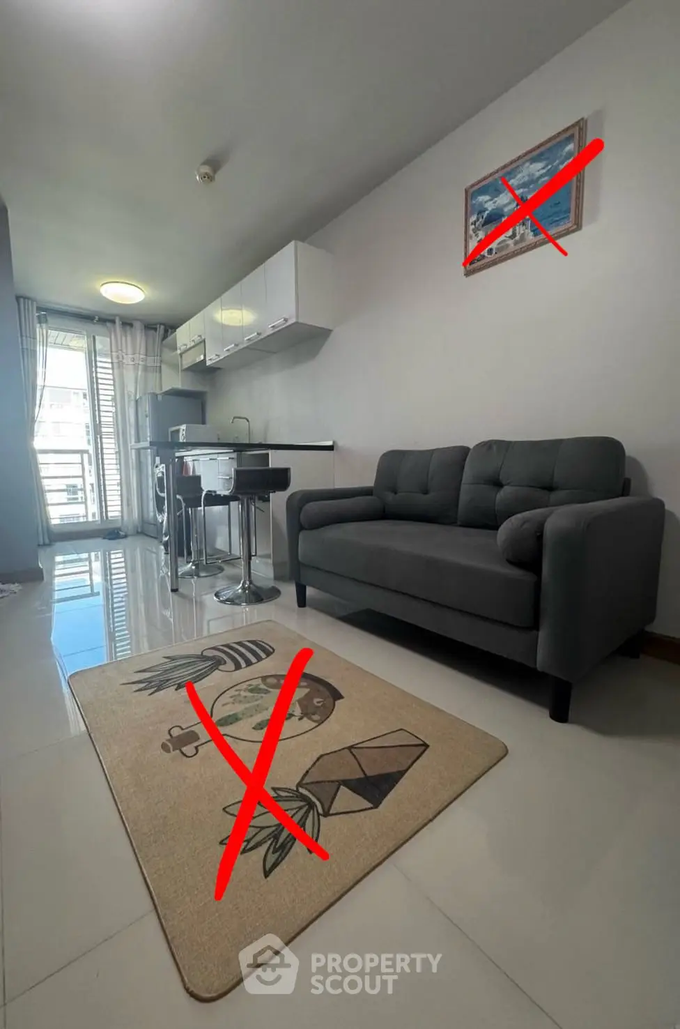 Modern living room with sleek kitchen and balcony access, featuring stylish furniture and bright natural light.