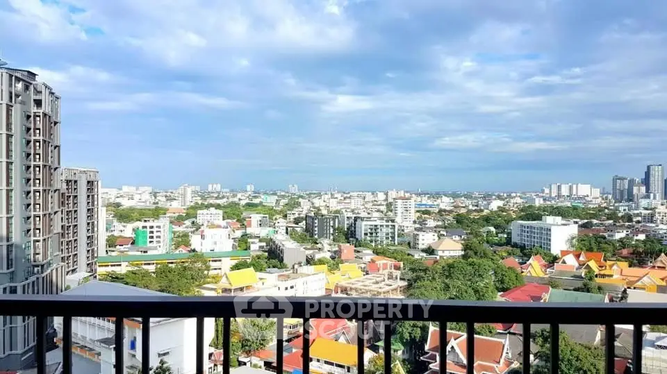Stunning cityscape view from a high-rise balcony showcasing vibrant urban living.