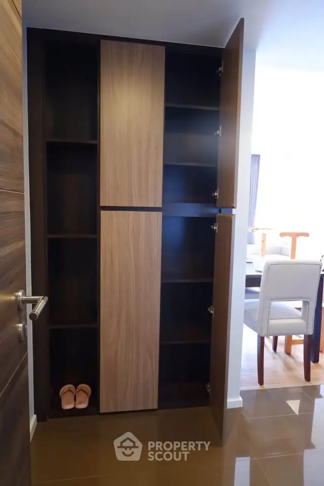 Modern storage cabinet in stylish apartment with dining area view