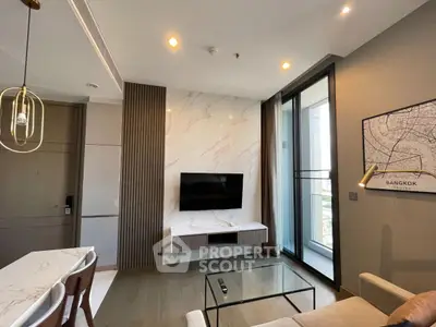 Modern living room with sleek design and balcony view in a high-rise apartment.