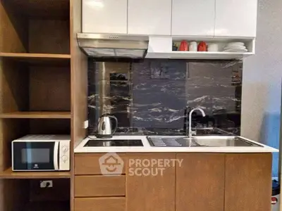 Modern kitchen with sleek cabinetry and built-in appliances