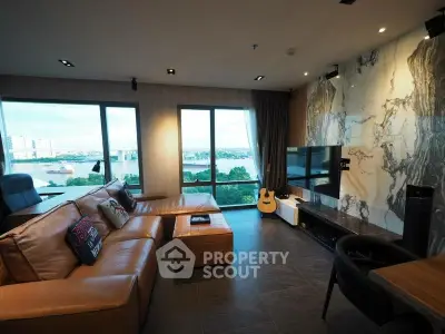 Luxurious living room with stunning river view and modern decor