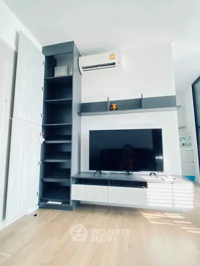 Modern living room with sleek TV unit and air conditioning