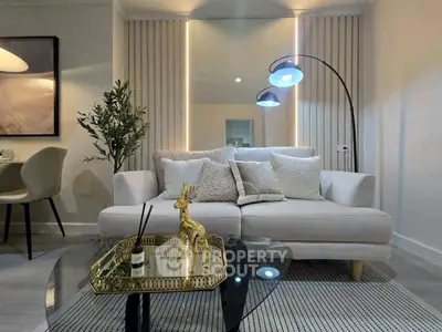 Stylish modern living room with elegant decor and cozy seating area.