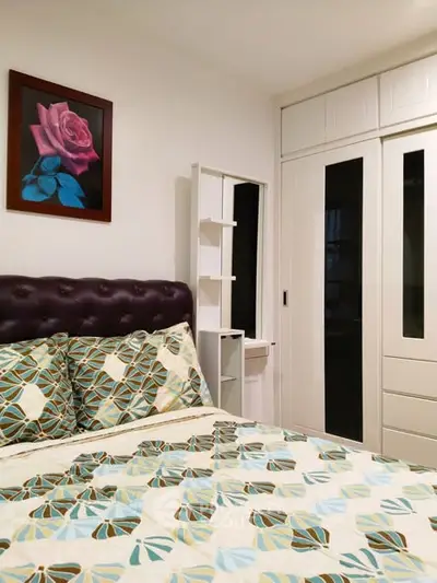 Cozy bedroom with stylish decor and ample closet space