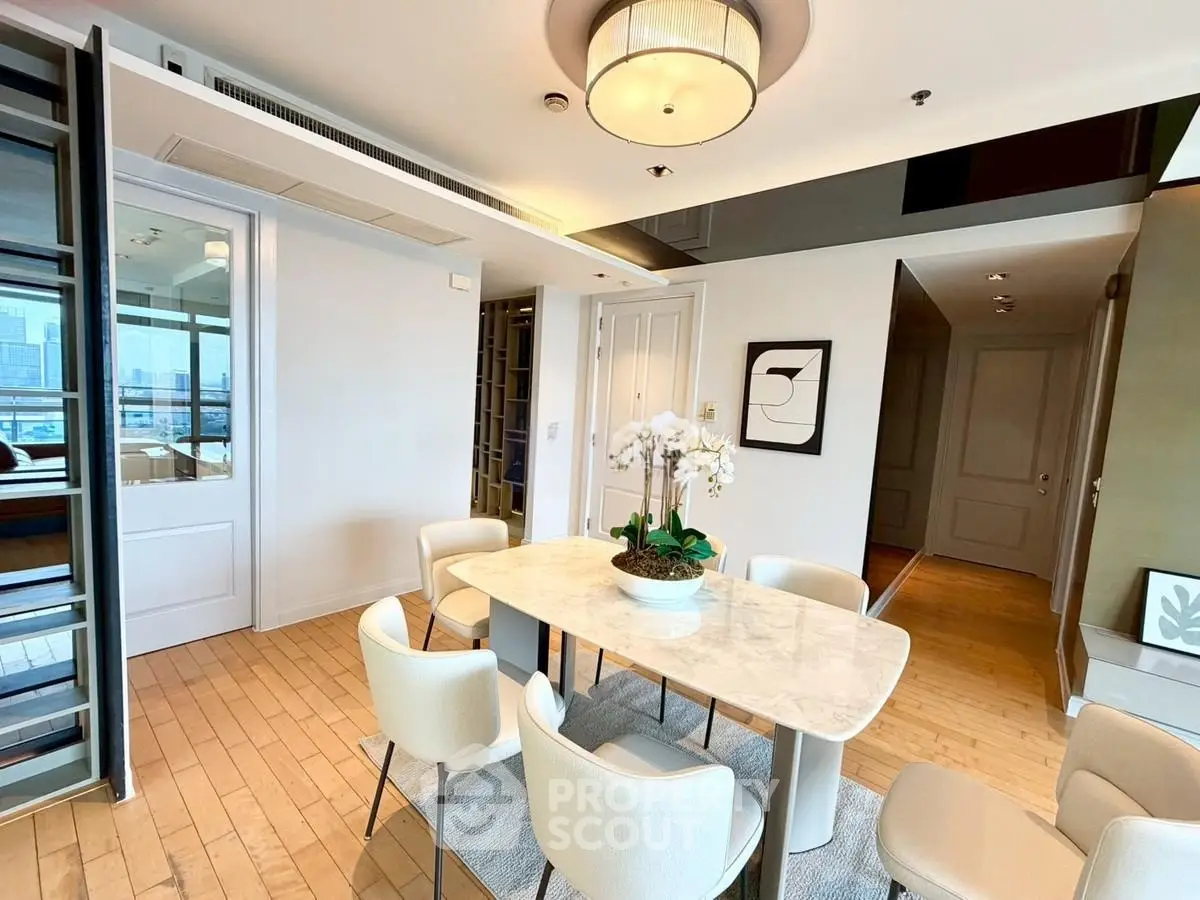 Elegant dining area with modern decor and city view