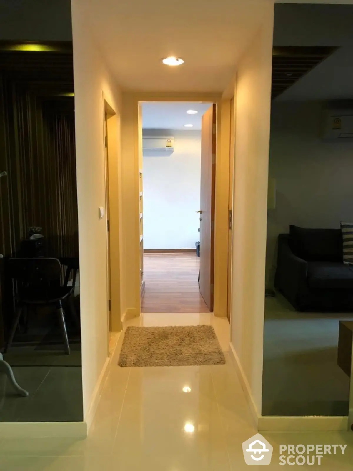 Modern apartment hallway with sleek design and ambient lighting