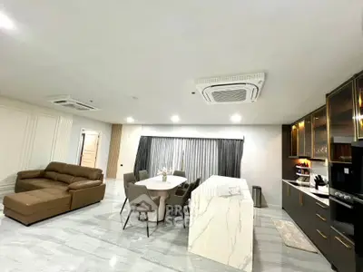 Spacious modern living room with open kitchen and elegant marble island