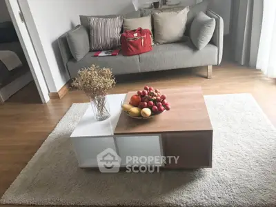Stylish living room with modern sofa and elegant coffee table centerpiece.
