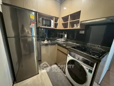 Modern kitchen with sleek appliances and ample storage space