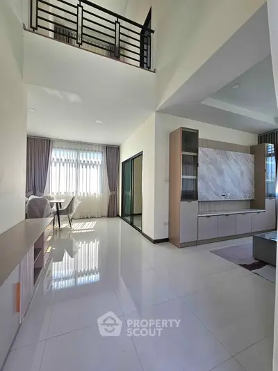 Spacious modern living room with high ceilings and elegant decor