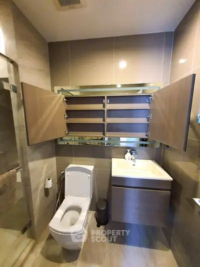Modern bathroom with sleek fixtures and ample storage space