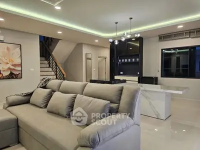Modern living room with stylish lighting and elegant decor in a contemporary home.