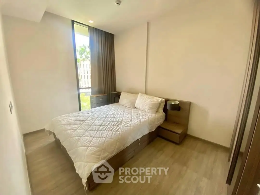 Modern bedroom with natural light and stylish decor