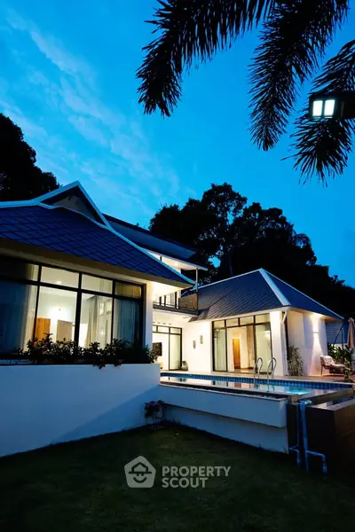 Stunning modern villa with pool and lush garden, perfect for luxury living.