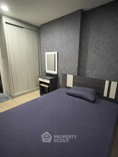 Modern bedroom with stylish decor and built-in wardrobe