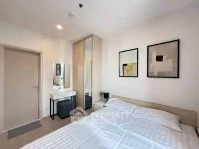 Modern bedroom with stylish decor and ample natural light