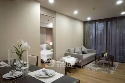 Modern open-plan living room with elegant dining area and cozy bedroom view.