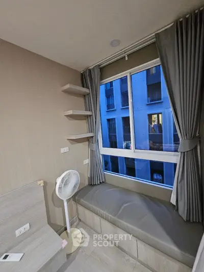 Cozy bedroom with window seating and modern decor