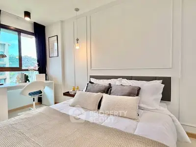 Modern bedroom with stylish decor and scenic window view