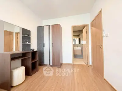 Modern bedroom with sleek wooden furniture and ample storage space
