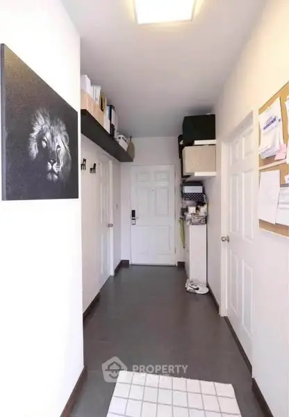 Spacious hallway with modern decor and ample storage space.