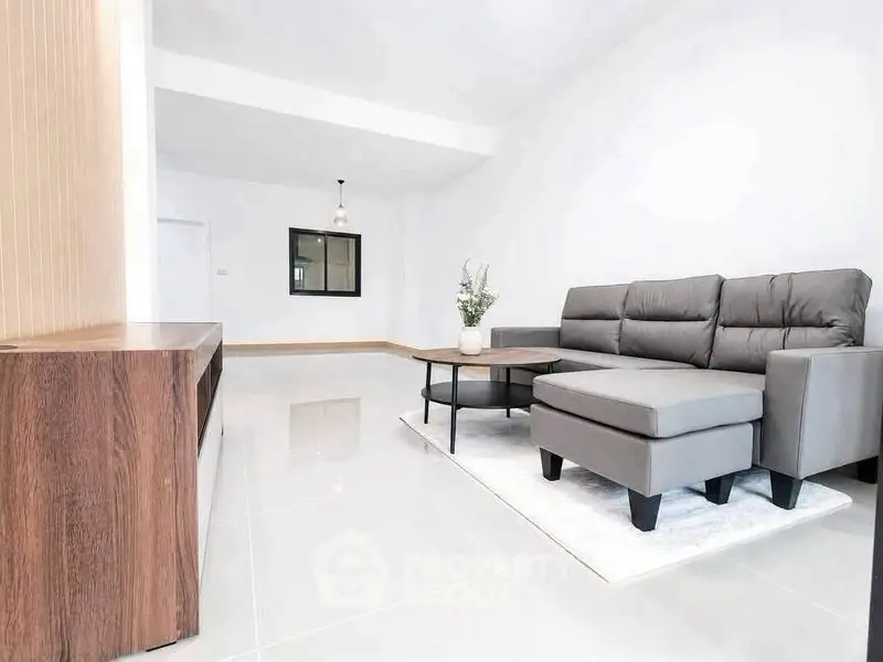 Spacious modern living room with sleek furniture and bright ambiance
