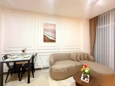 Elegant living room with modern sofa and dining area in stylish apartment