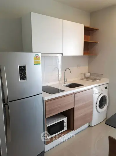 Modern compact kitchen with sleek appliances and efficient layout