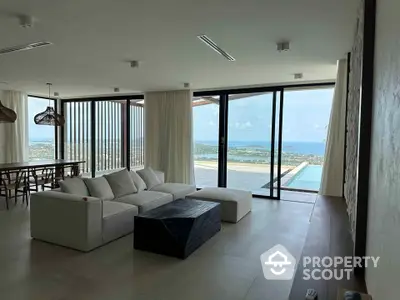 Luxurious living room with panoramic ocean view and modern furnishings