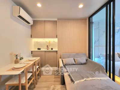 Modern living room with cozy sofa and dining area in stylish apartment