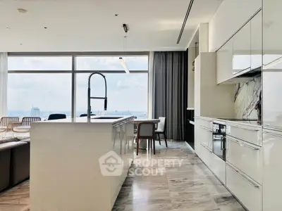 Luxurious modern kitchen with stunning city view and sleek design