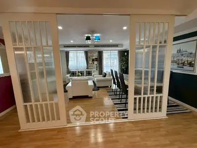 Spacious living room with elegant sliding doors and modern decor