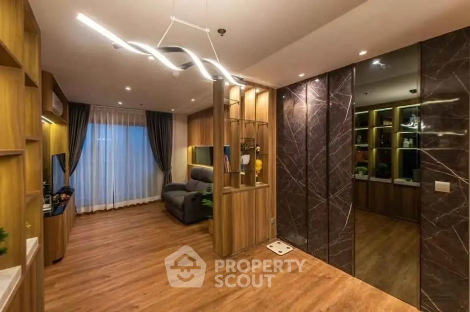 Luxurious modern living room with elegant lighting and wooden flooring