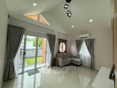 Bright and airy living room with modern decor and garden view.