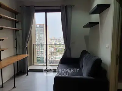 Modern living room with city view balcony, sleek shelves, and cozy sofa.