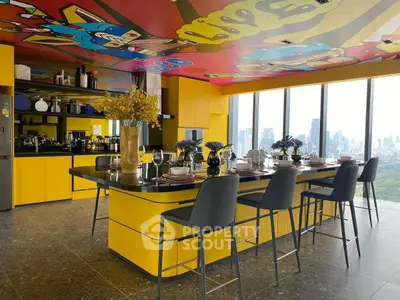 Stunning modern kitchen with vibrant yellow cabinets and city skyline view.