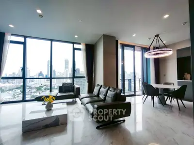 Luxurious high-rise living room with stunning city views and modern furnishings.