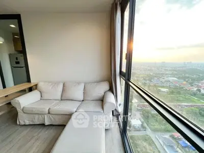 Spacious living room with panoramic city view and cozy sofa