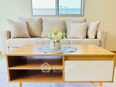 Stylish living room with cozy sofa and elegant wooden coffee table