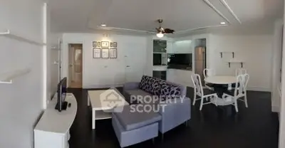 Spacious modern living room with open kitchen and stylish furniture