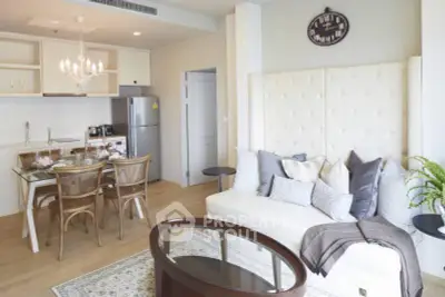 Chic modern living room with open kitchen, elegant dining area, and stylish decor in a cozy apartment.