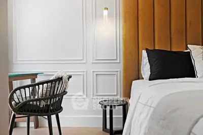 Elegant bedroom with modern decor and stylish furniture, perfect for a cozy retreat.