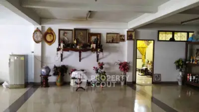 Spacious living area with decorative wall art and elegant vases, perfect for showcasing personal style.