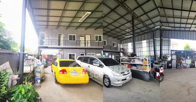 Spacious industrial-style property with ample parking and storage space.