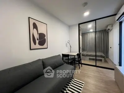 Modern studio apartment with sleek design and cozy living area