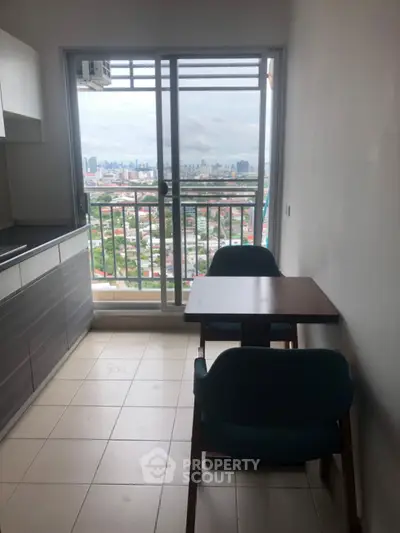 Cozy balcony with stunning city view, perfect for relaxation and dining.