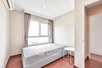 Bright and cozy bedroom with large window and minimalist decor